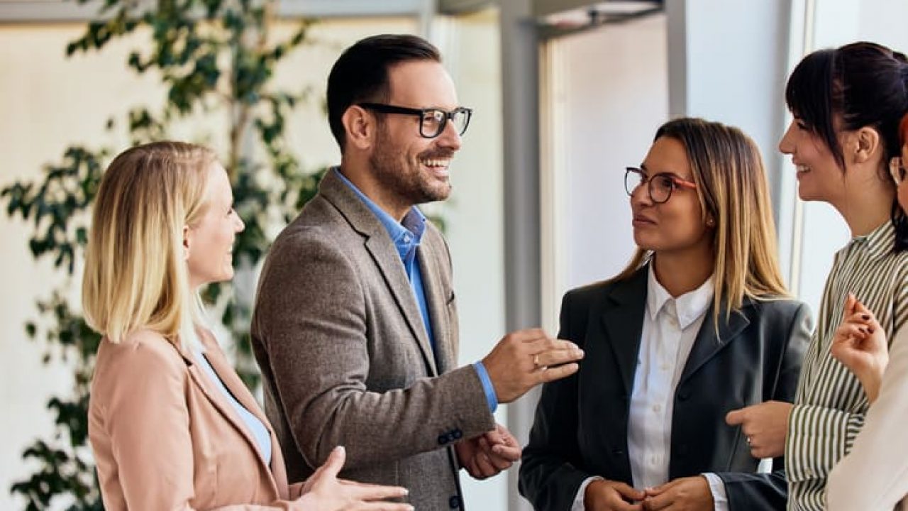 Business Professionals Engaging in a Productive Discussion in a Modern Office Setting