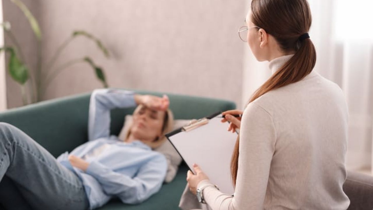 Professional psychotherapist working with patient in office